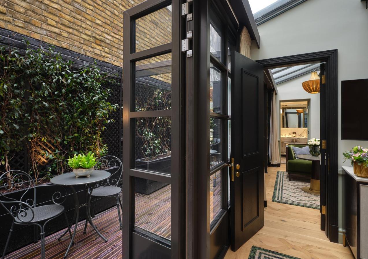 The Mayfair Townhouse - An Iconic Luxury Hotel London Exterior photo The interior of a typical apartment at The Standard East Village